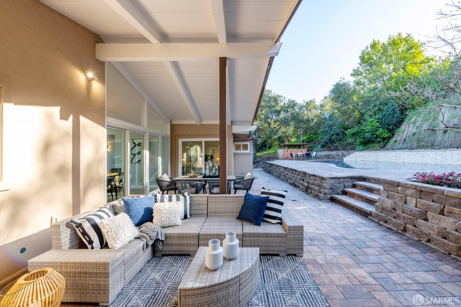 155 Brookwood Road Woodside, CA 94062 - Photo 39 of 60 a outdoor space with patio the couches and a potted plant on the table