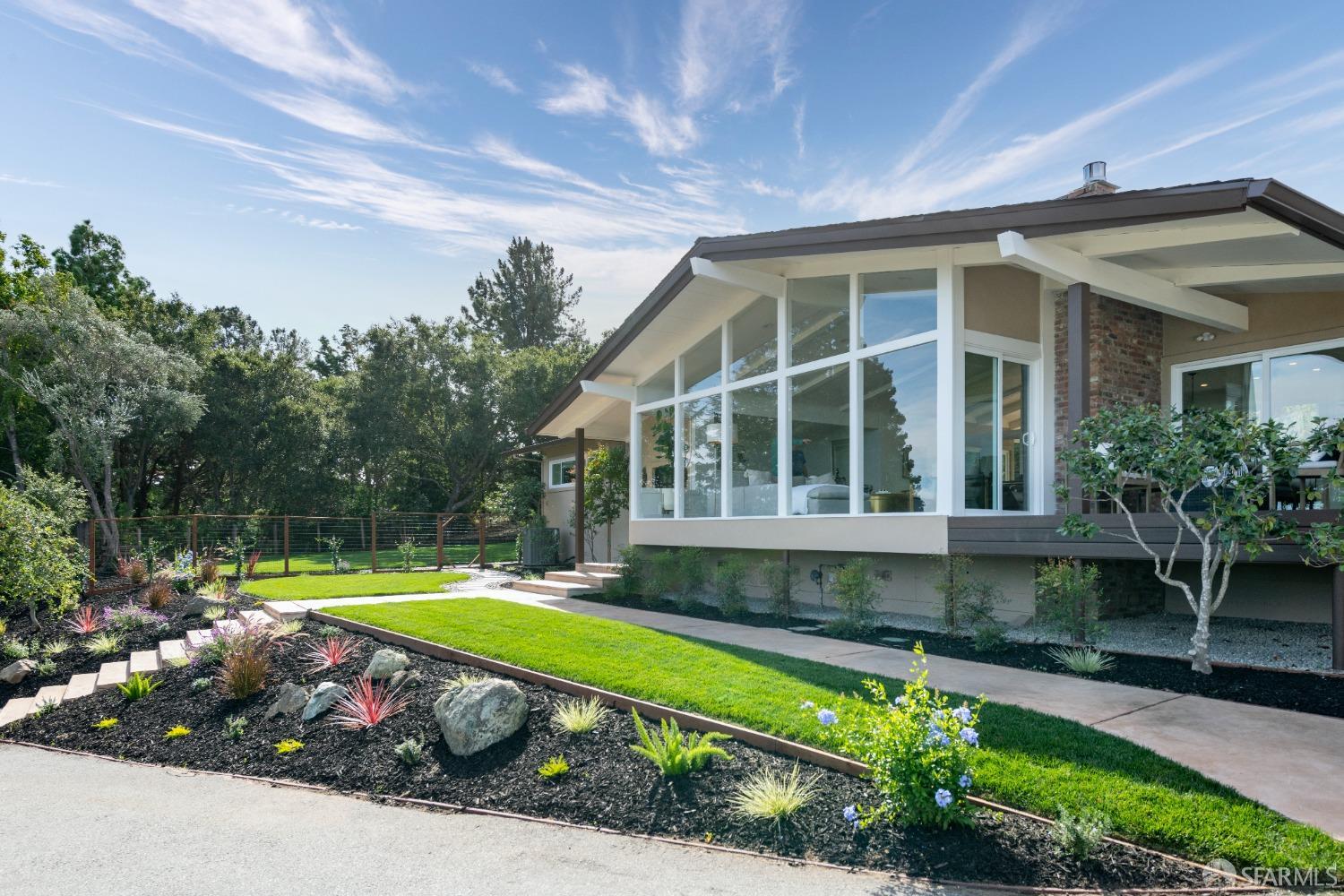 155 Brookwood Road Woodside, CA 94062 - Photo 54 of 60 a house with swimming pool in front of it