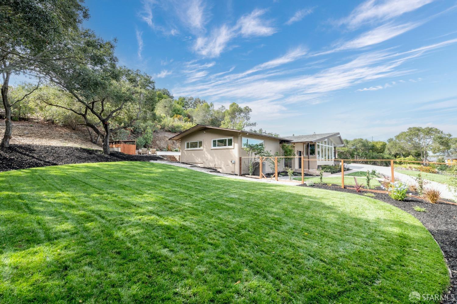 155 Brookwood Road Woodside, CA 94062 - Photo 59 of 60 a view of a house with backyard and sitting area