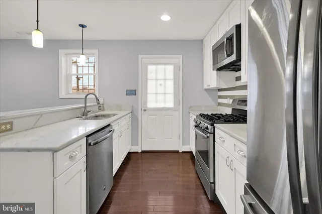 a kitchen with sink and window