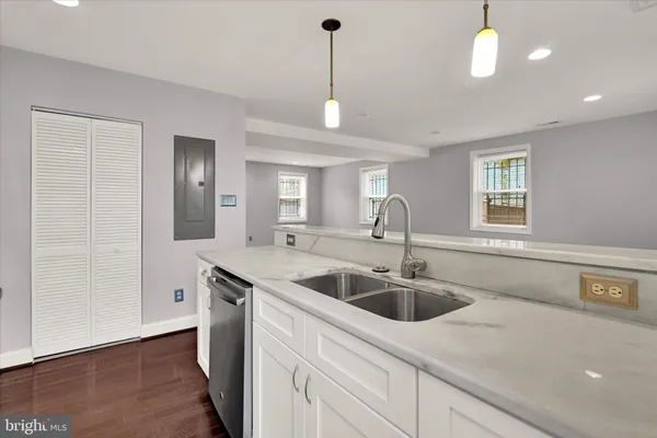 a kitchen with a sink and a window