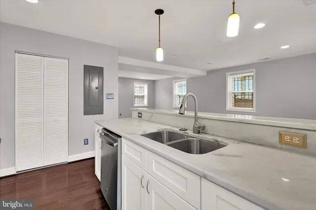 a kitchen with a sink and a window