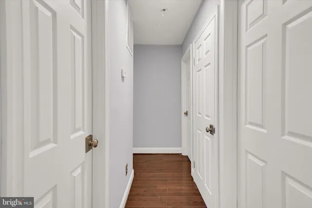 a view of a hallway with washer and dryer