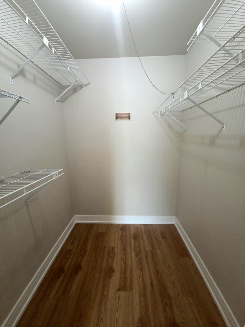 366 Pinetree Lane, Unit B1 Schaumburg, IL 60193 - Photo 21 of 23 a view of a room with wooden floor