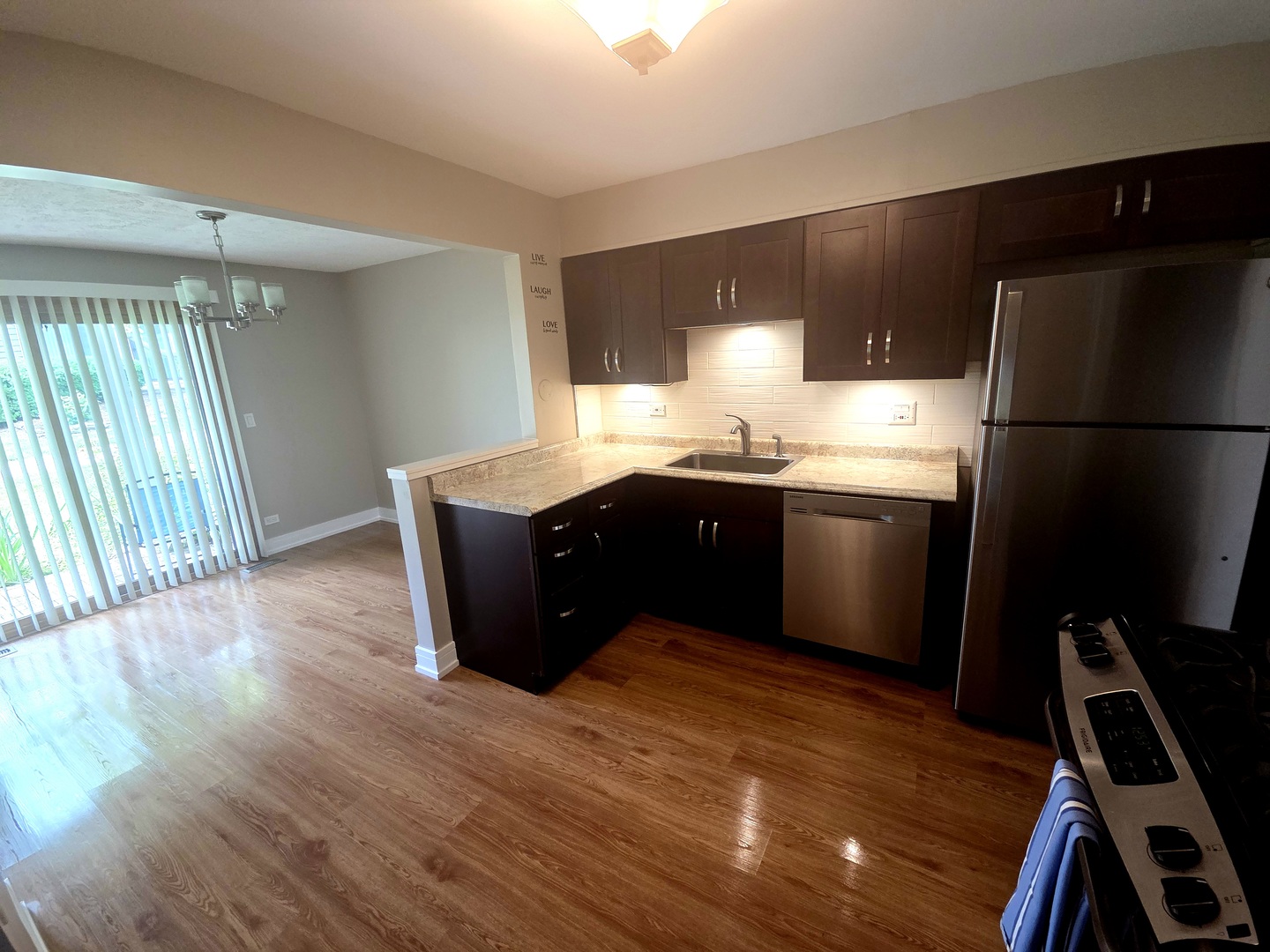 366 Pinetree Lane, Unit B1 Schaumburg, IL 60193 - Photo 8 of 23 a kitchen with stainless steel appliances granite countertop a refrigerator a sink and a stove