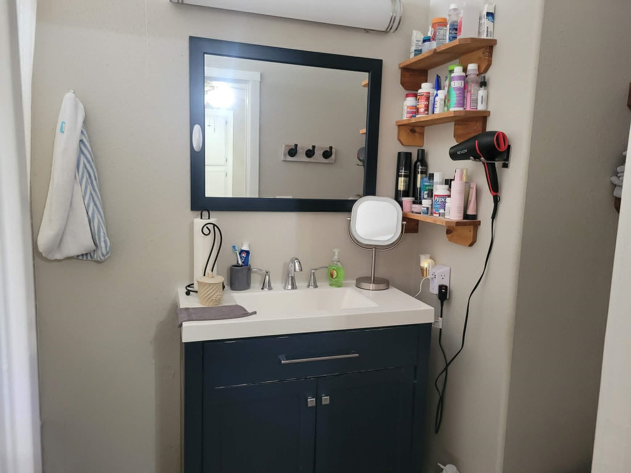 493 Mule Deer Road Coleville, CA 96107 - Photo 18 of 39 a bathroom with a sink vanity and mirror