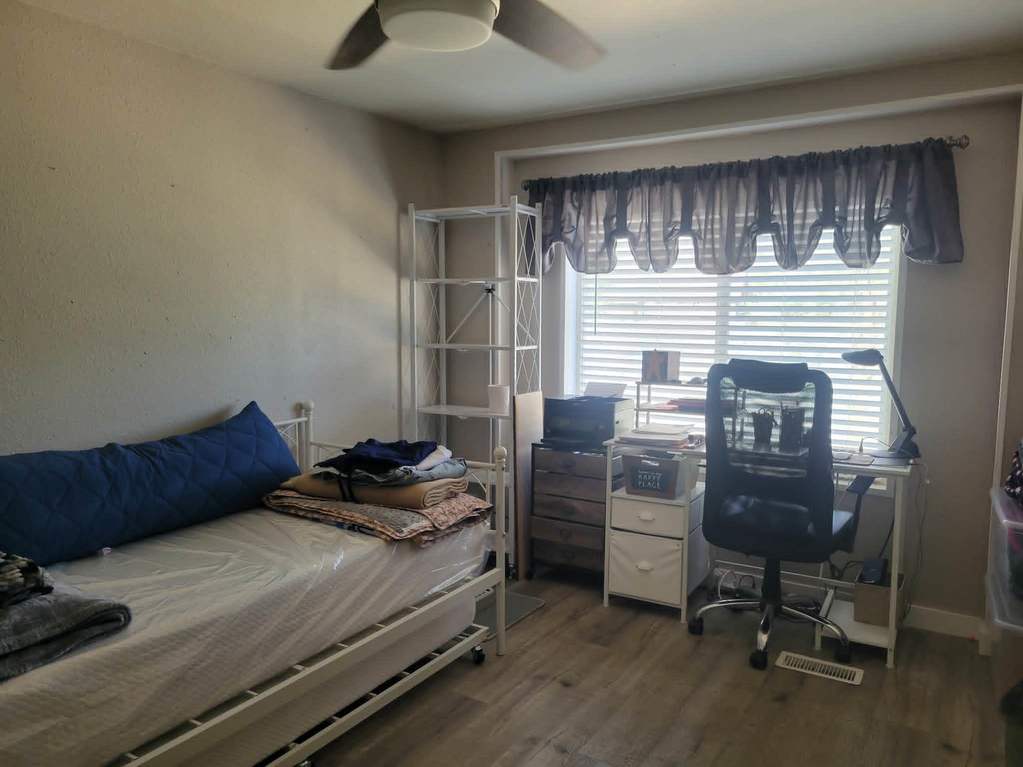 493 Mule Deer Road Coleville, CA 96107 - Photo 19 of 39 a bedroom with a bed and a chair