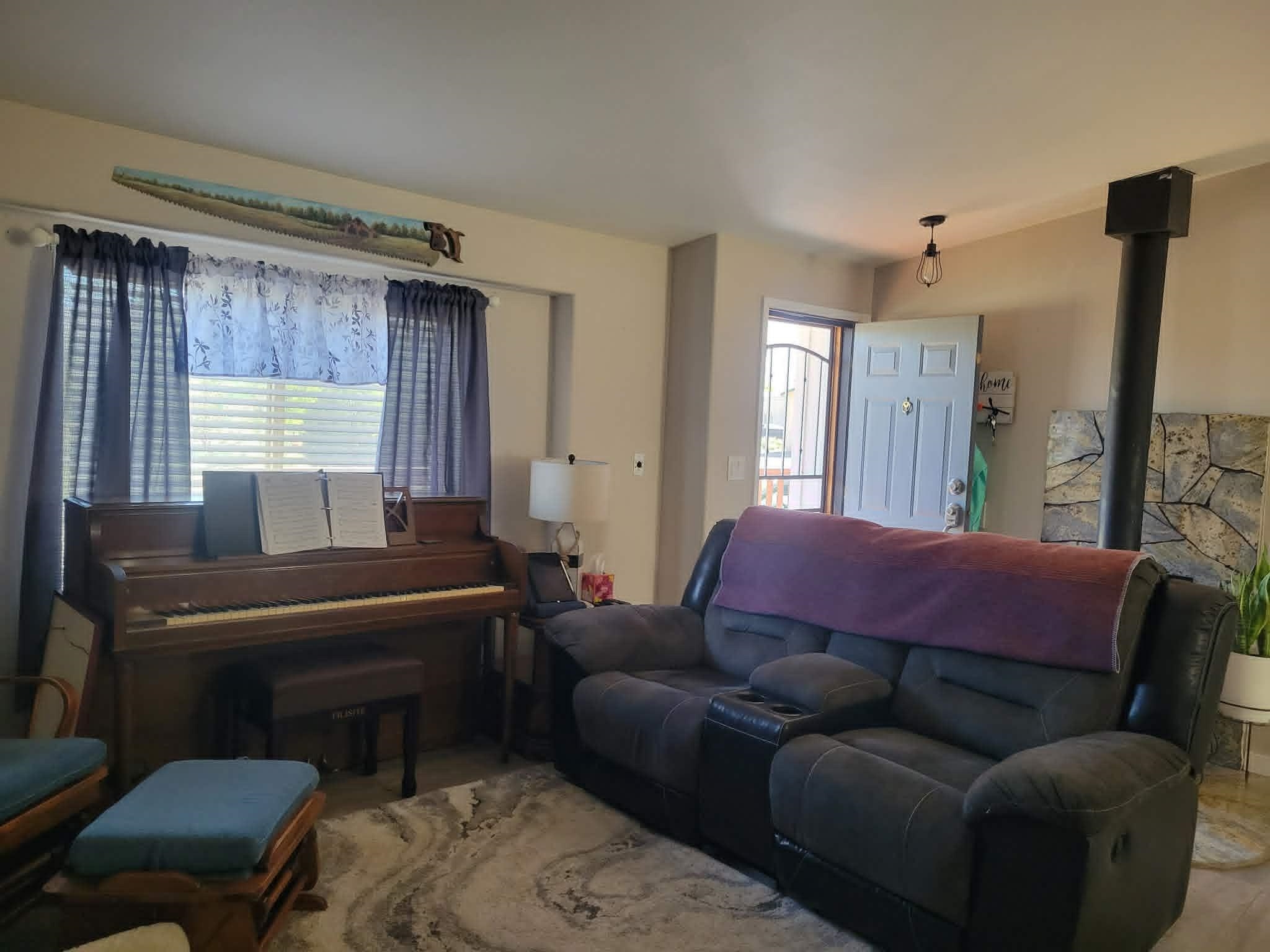 493 Mule Deer Road Coleville, CA 96107 - Photo 4 of 39 a living room with furniture and a piano