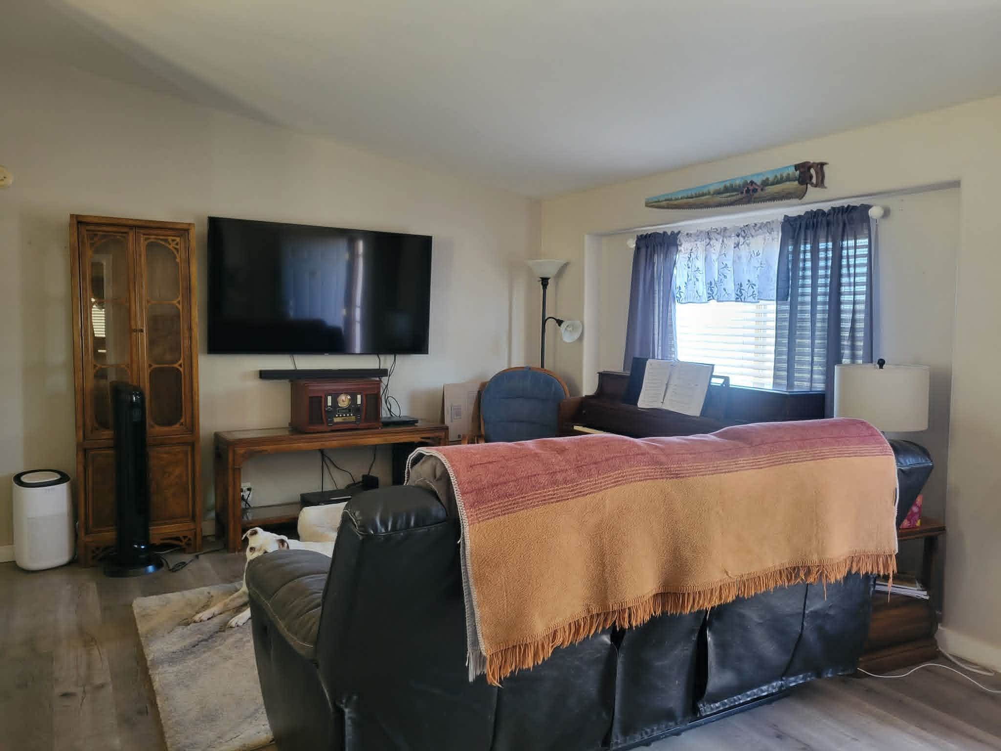 493 Mule Deer Road Coleville, CA 96107 - Photo 6 of 39 a bedroom with a bed and a flat screen tv