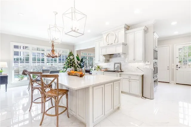 a view of a dining room with furniture wooden floor and chandelier