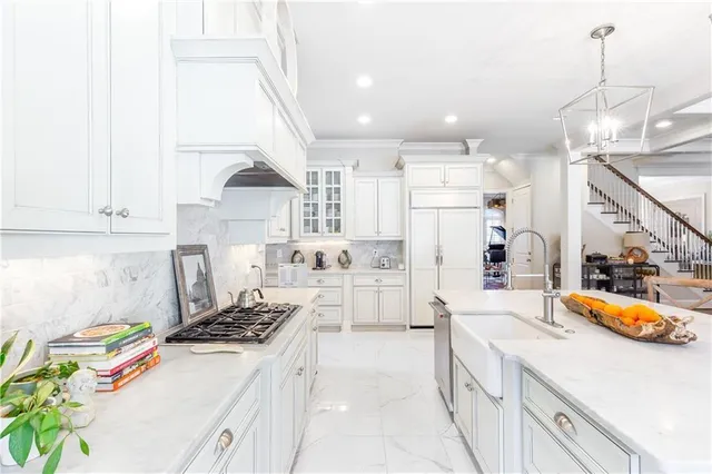 a bedroom with a large bed and a couch