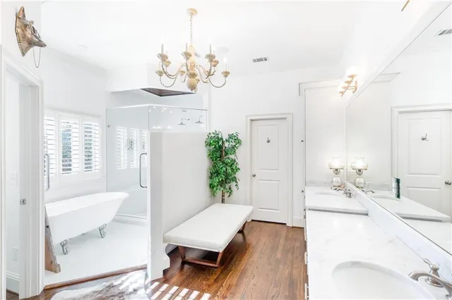 a living room with a bed furniture and a large window