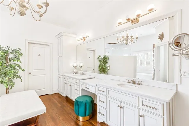 a spacious bedroom with a bed and a table in it