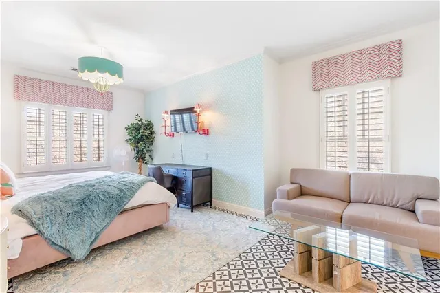 a living room with stainless steel appliances kitchen island granite countertop furniture and a fireplace