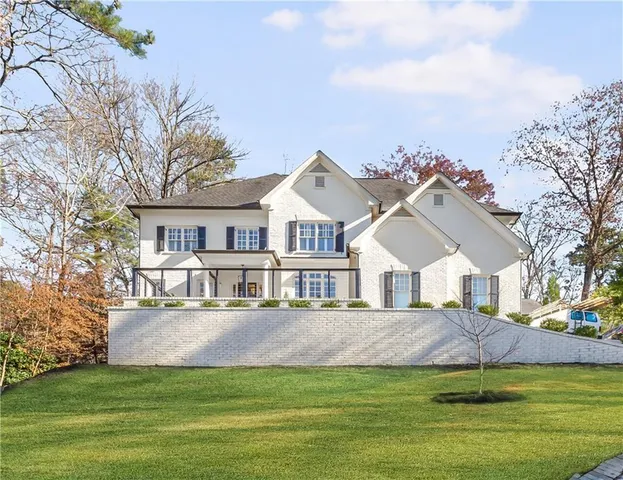 a view of a dining room with furniture wooden floor and chandelier
