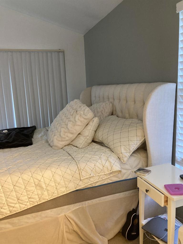 16941 Meadowlark Ridge Road, Unit 1 San Diego, CA 92127 - Photo 14 of 30 a bedroom with a bed and a window