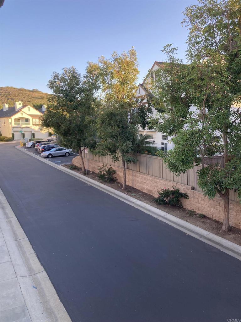 16941 Meadowlark Ridge Road, Unit 1 San Diego, CA 92127 - Photo 18 of 30 a view of a street with a houses