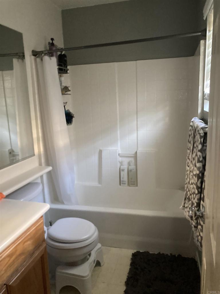 16941 Meadowlark Ridge Road, Unit 1 San Diego, CA 92127 - Photo 22 of 30 a bathroom with a sink toilet and shower