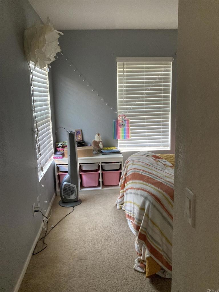 16941 Meadowlark Ridge Road, Unit 1 San Diego, CA 92127 - Photo 23 of 30 a bedroom with bed and a window