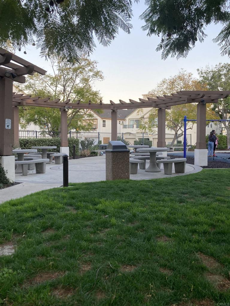 16941 Meadowlark Ridge Road, Unit 1 San Diego, CA 92127 - Photo 27 of 30 a view of a house with a backyard and a patio