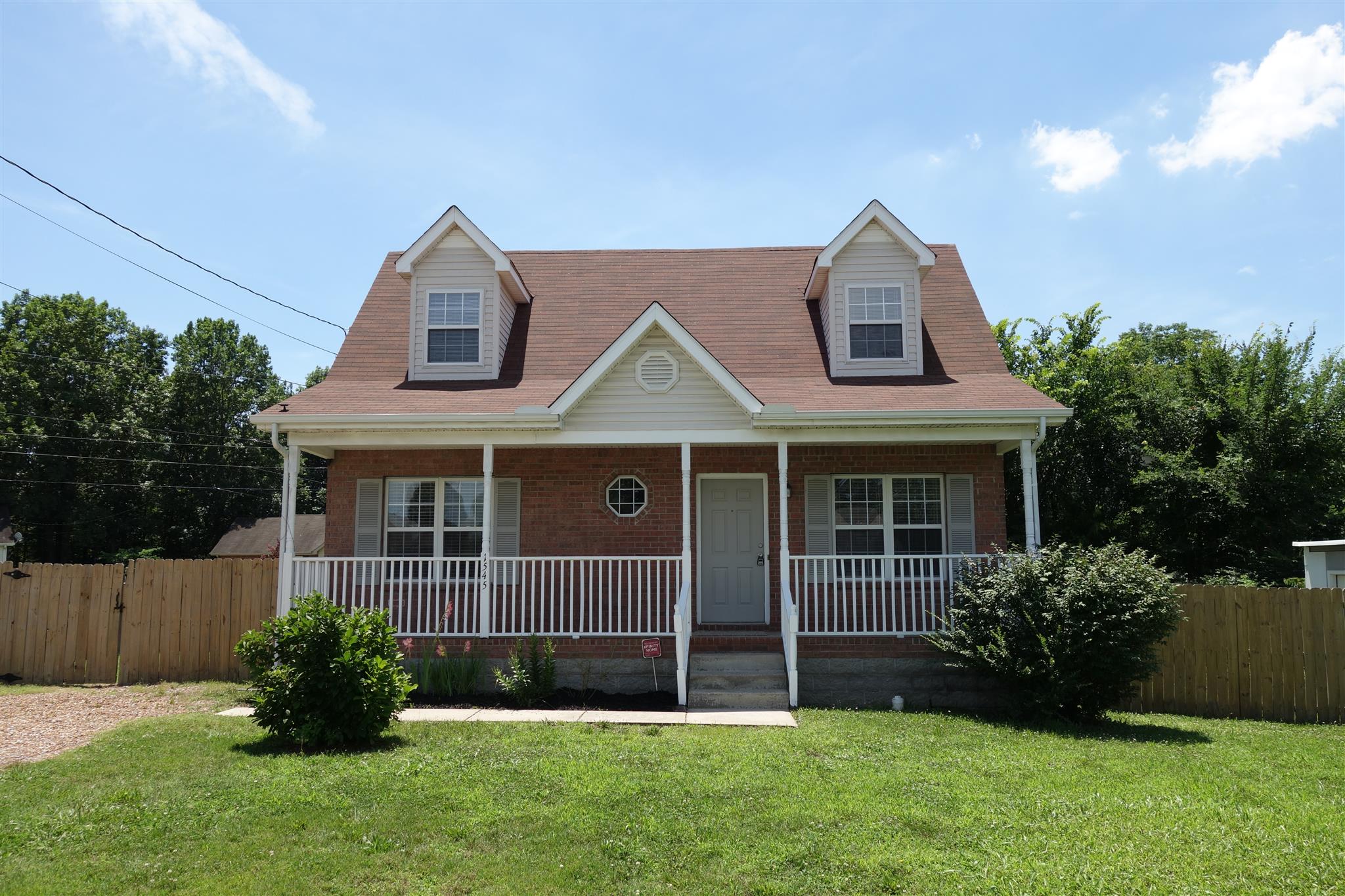 1545 Ridgemont Drive La Vergne, TN 37086 - Photo 1 of 25 a front view of a house with a garden