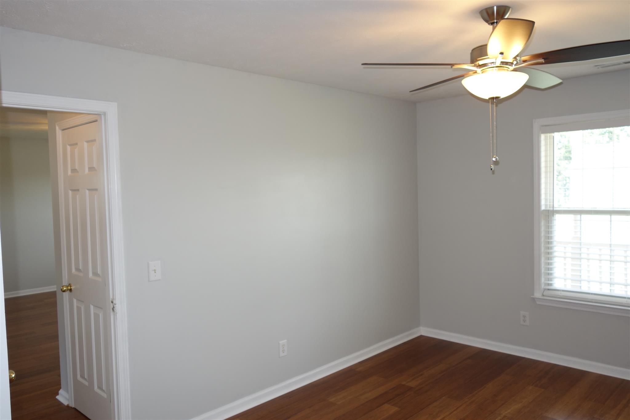 1545 Ridgemont Drive La Vergne, TN 37086 - Photo 12 of 25 an empty room with wooden floor and window