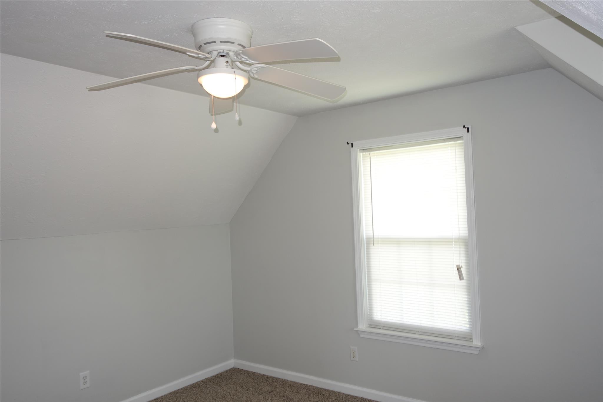 1545 Ridgemont Drive La Vergne, TN 37086 - Photo 16 of 25 an empty room with a window and a fan
