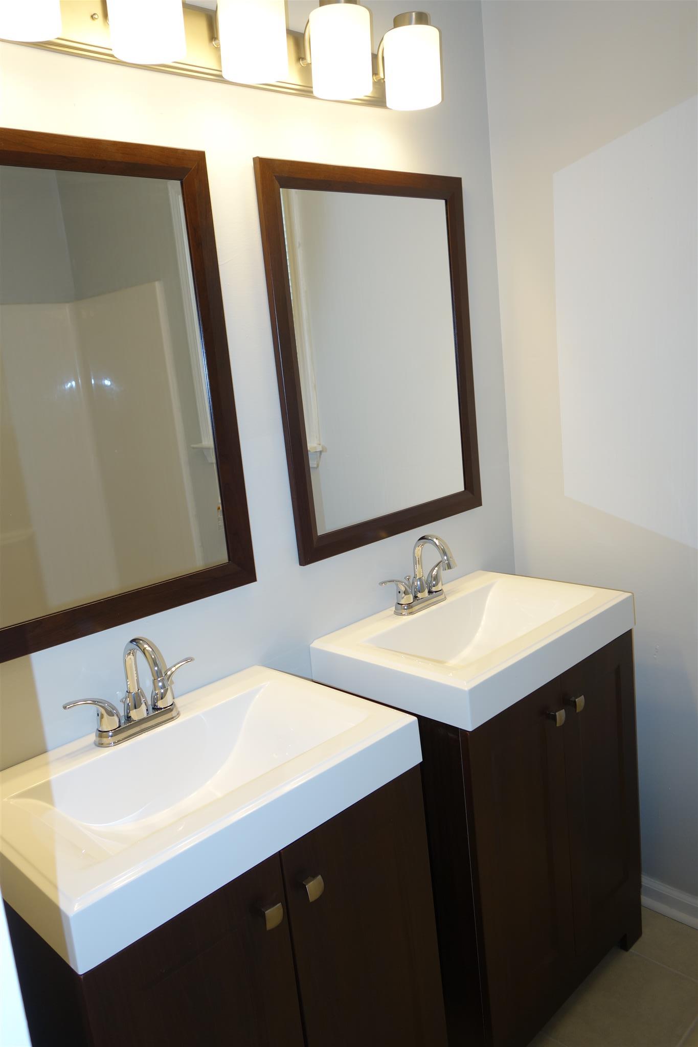1545 Ridgemont Drive La Vergne, TN 37086 - Photo 17 of 25 a bathroom with a sink vanity and a mirror
