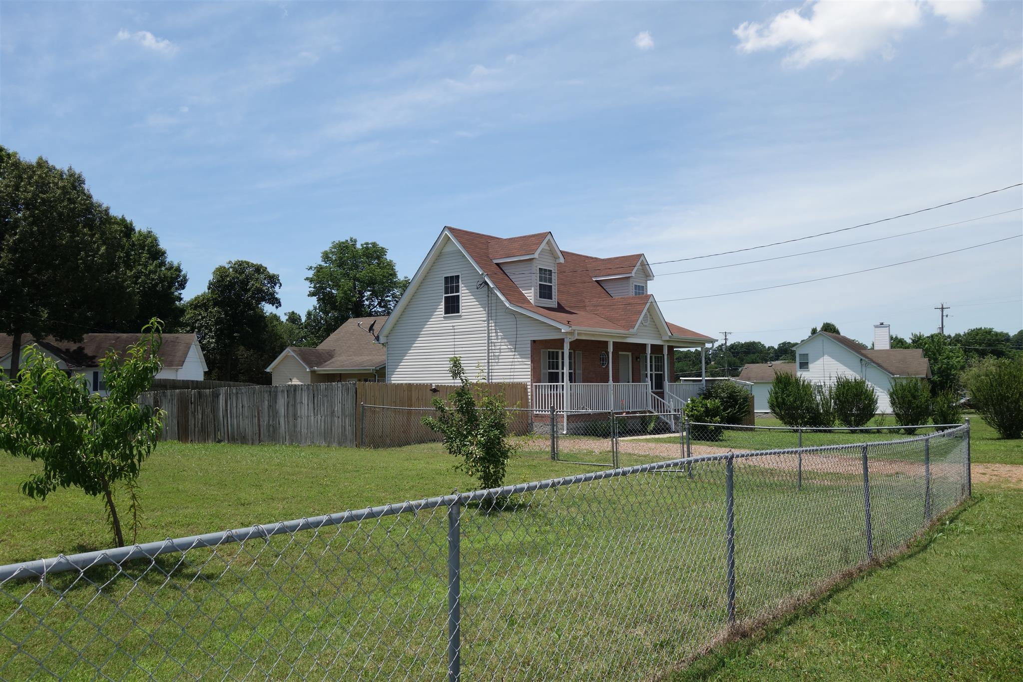 1545 Ridgemont Drive La Vergne, TN 37086 - Photo 3 of 25 a view of a house with a big yard and potted plants