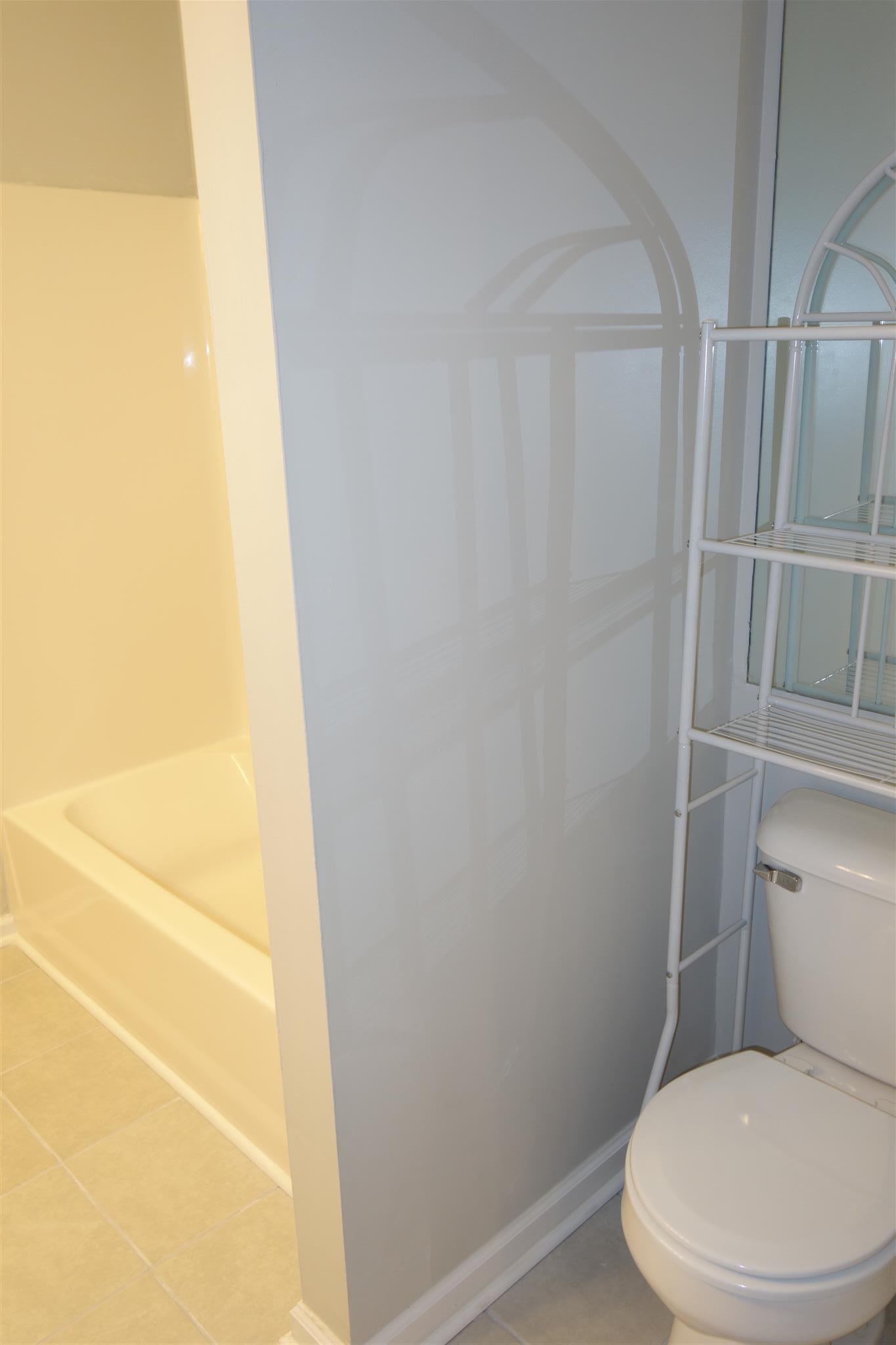 1545 Ridgemont Drive La Vergne, TN 37086 - Photo 23 of 25 a white toilet sitting next to a shower
