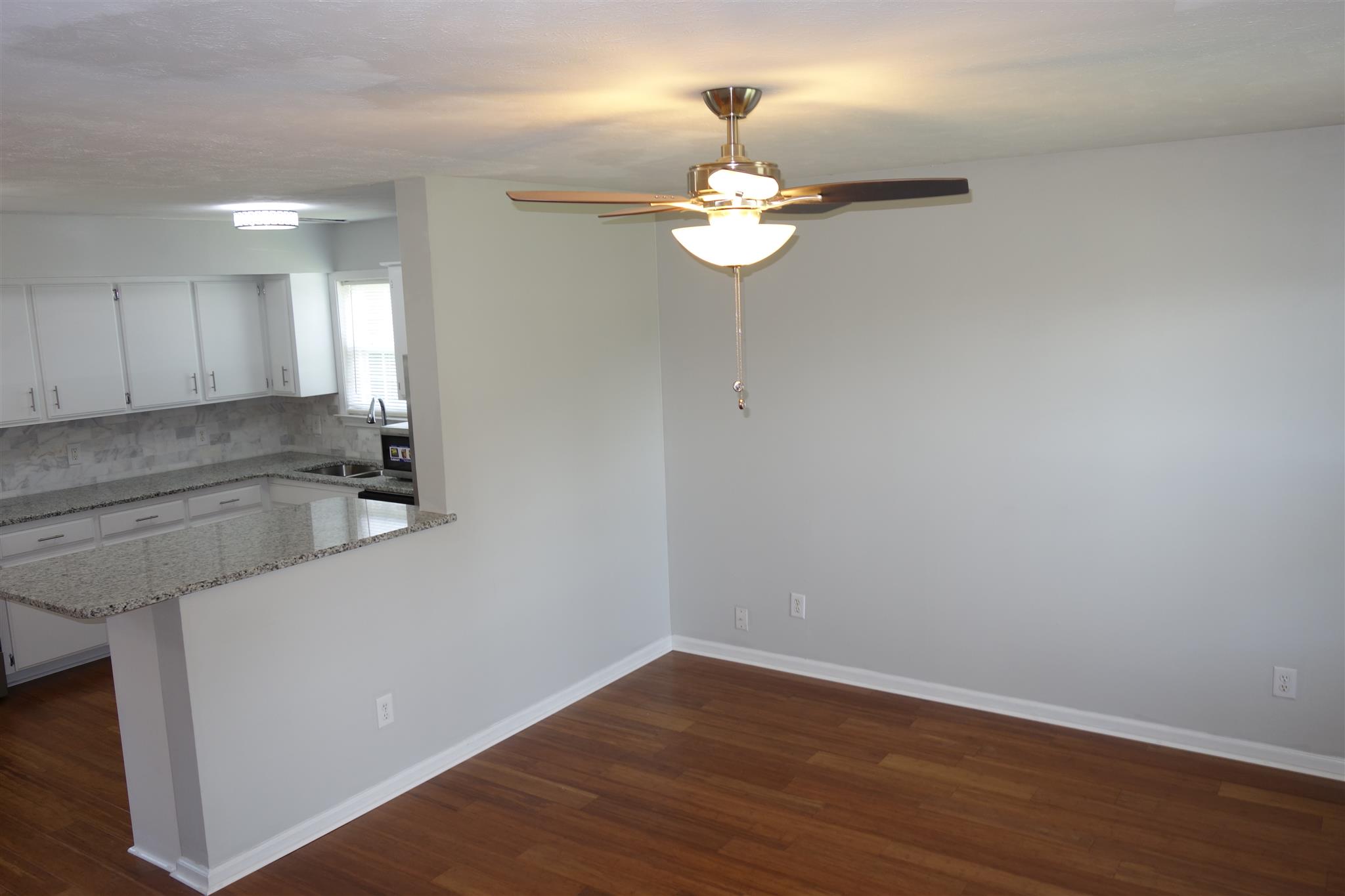 1545 Ridgemont Drive La Vergne, TN 37086 - Photo 7 of 25 an empty room with wooden floor and window