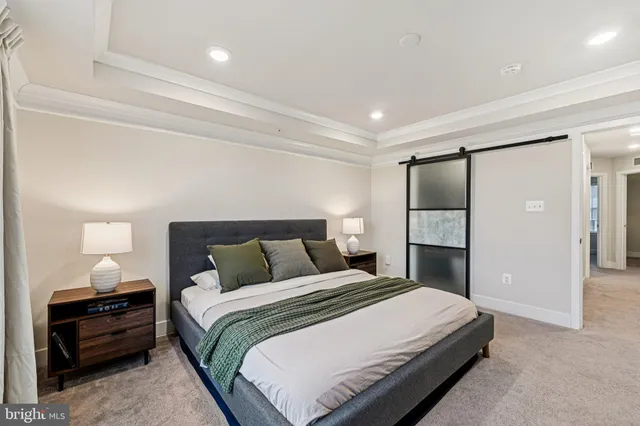 a bedroom with a bed and a lamp