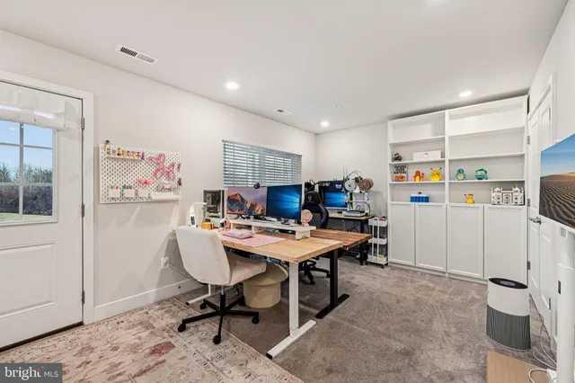 a workspace with furniture and window