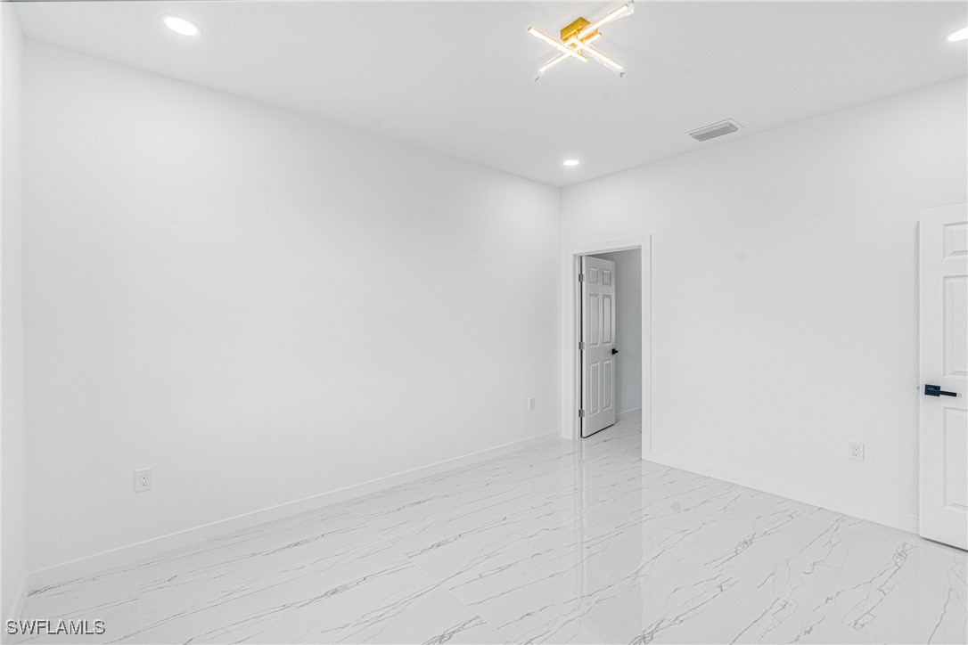 3604 26th Street Southwest Lehigh Acres, FL 33976 - Photo 16 of 38 a view of an empty room