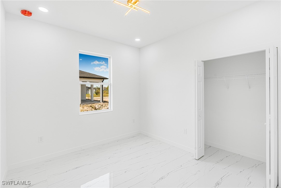 3604 26th Street Southwest Lehigh Acres, FL 33976 - Photo 17 of 38 a view of an empty room