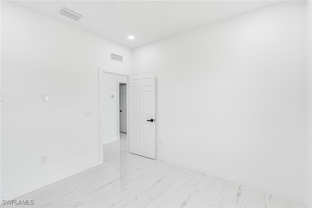 3604 26th Street Southwest Lehigh Acres, FL 33976 - Photo 19 of 38 a view of an empty room
