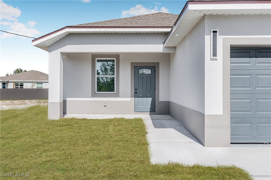 3604 26th Street Southwest Lehigh Acres, FL 33976 - Photo 2 of 38 a view of an entryway of the house