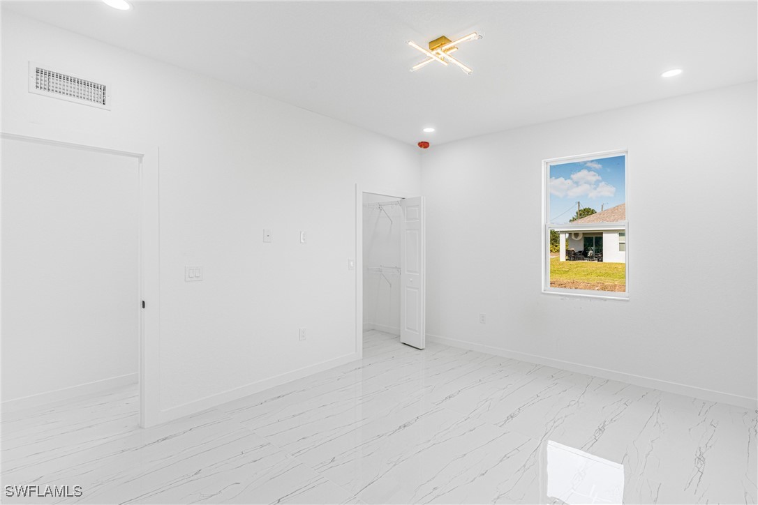 3604 26th Street Southwest Lehigh Acres, FL 33976 - Photo 21 of 38 a view of an empty room