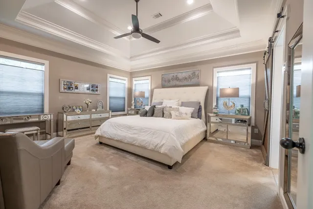 a bathroom with a granite countertop sink mirror vanity and toilet