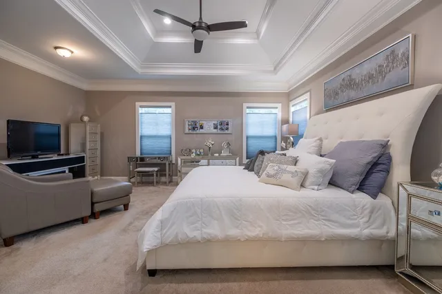 an empty room with ceiling fan and window