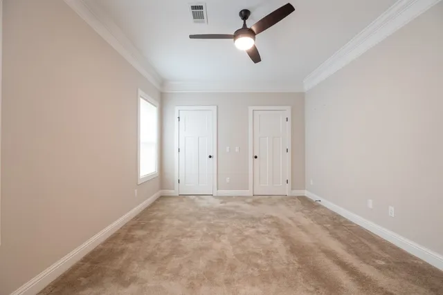 a bathroom with a double vanity sink toilet and a mirror