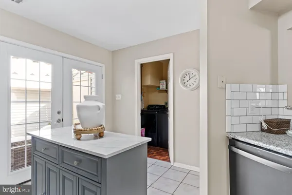 a kitchen with a sink cabinets and window