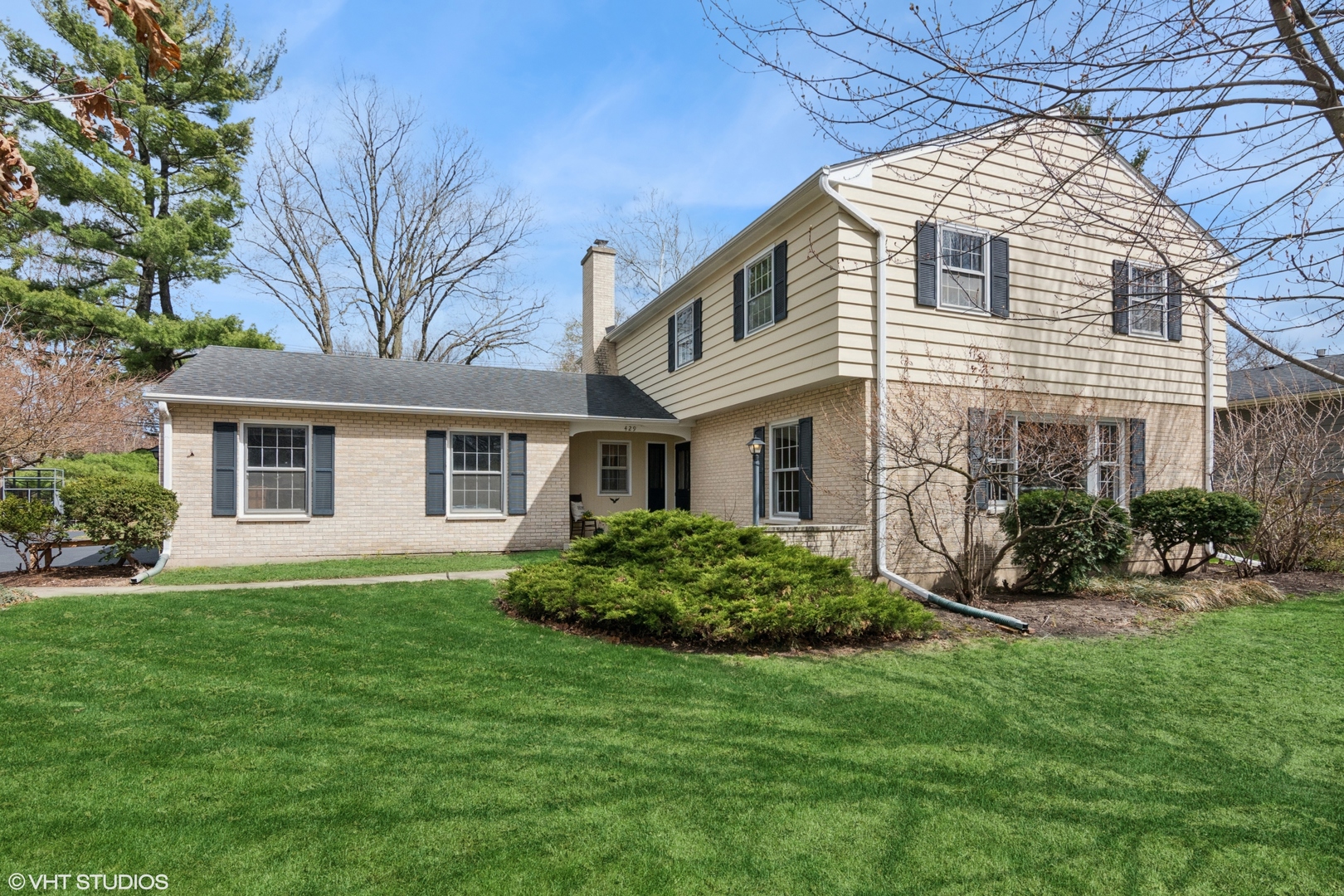 a front view of a house with a yard