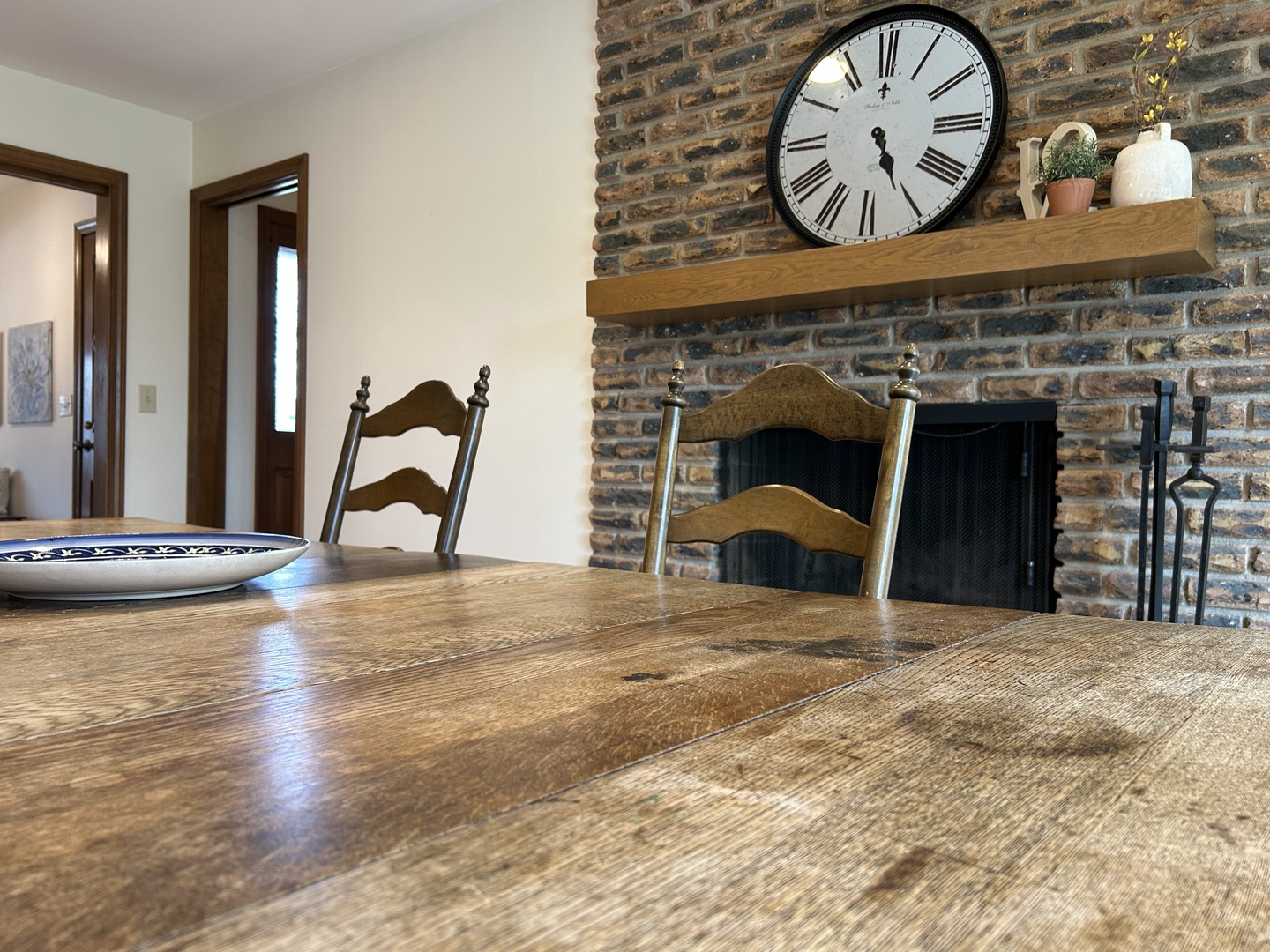 429 Grant Avenue Geneva, IL 60134 - Photo 12 of 34 a view of a fireplace with a table and a clock