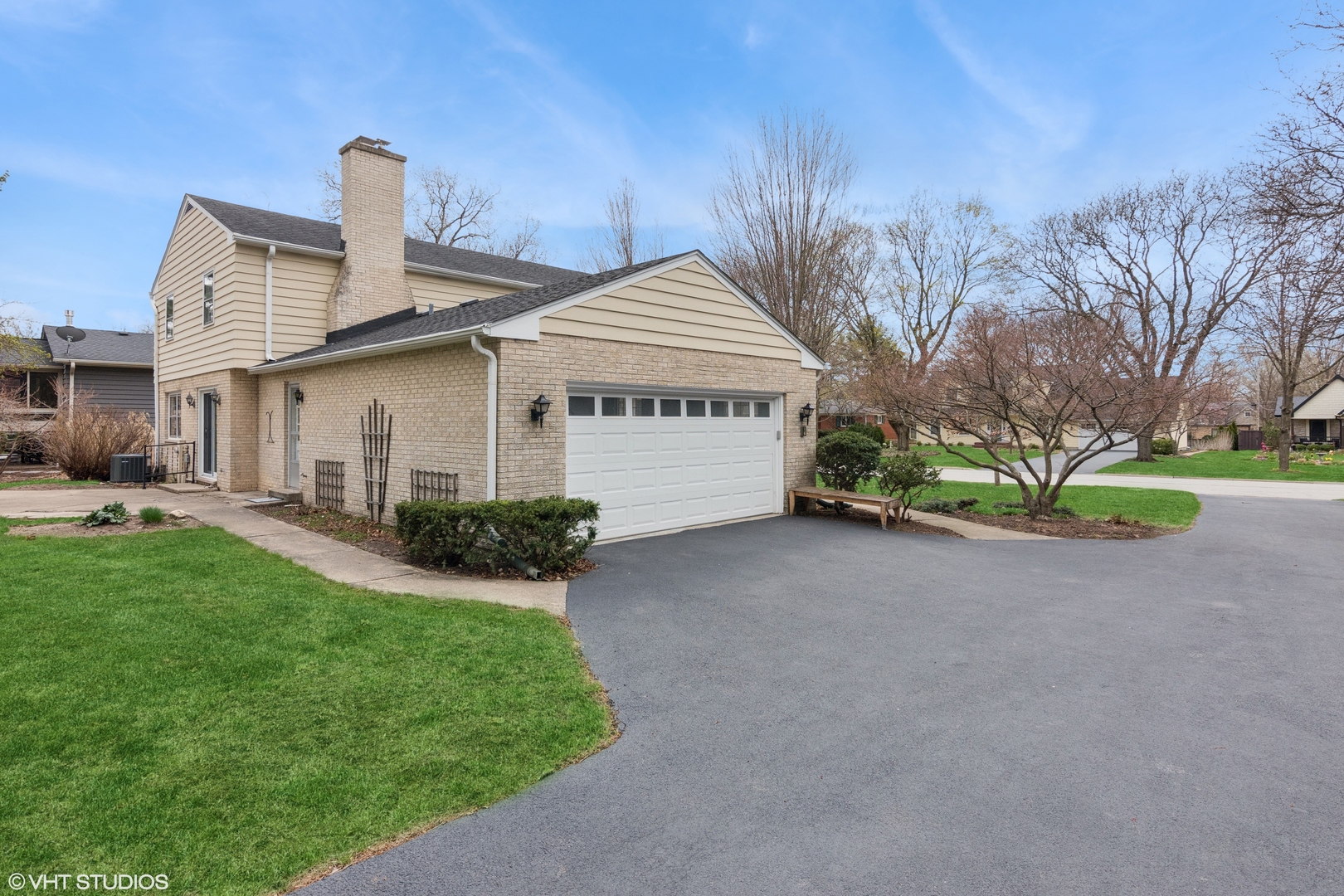429 Grant Avenue Geneva, IL 60134 - Photo 2 of 34 a front view of a house with a garden and plants