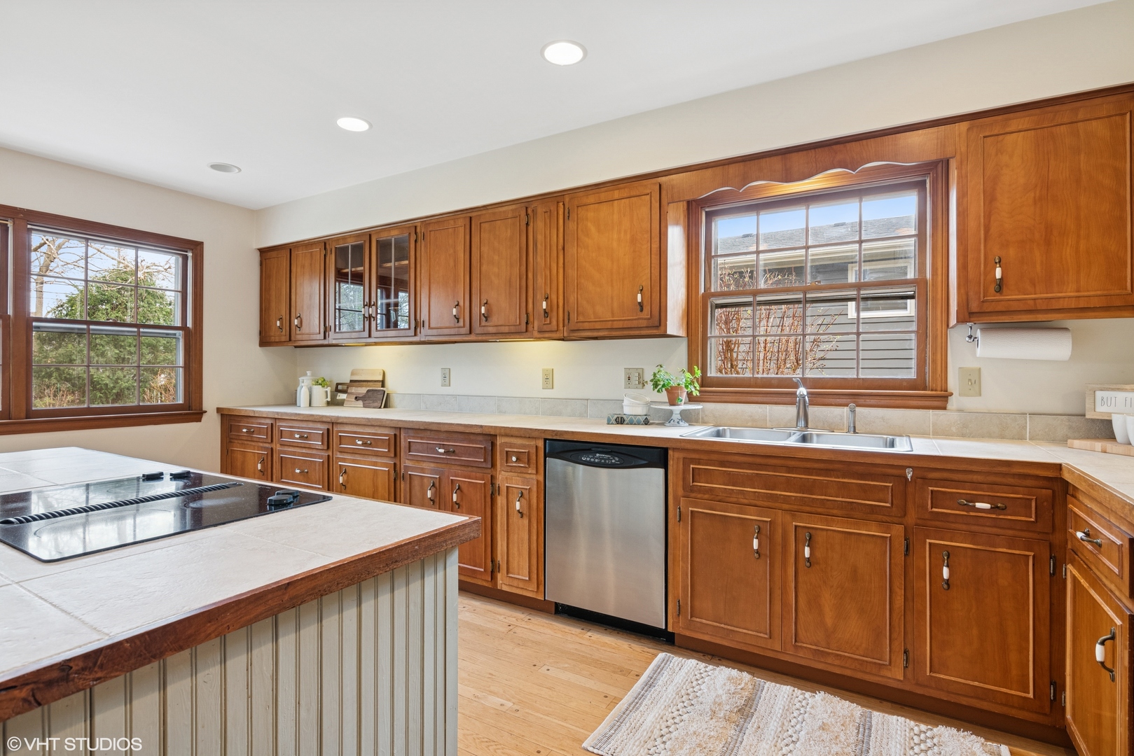 429 Grant Avenue Geneva, IL 60134 - Photo 7 of 34 a kitchen with stainless steel appliances granite countertop wooden cabinets a sink and a stove