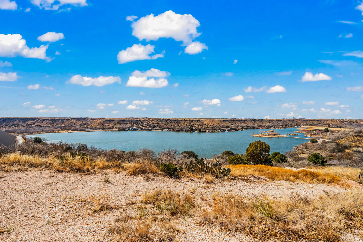 87 East Canyonview Drive Ransom Canyon, TX 79366 - Photo 32 of 42 a view of a lake with a beach