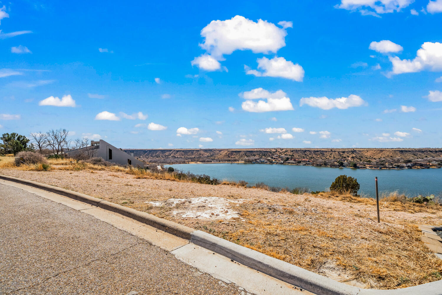 87 East Canyonview Drive Ransom Canyon, TX 79366 - Photo 42 of 42 a view of a lake with a beach