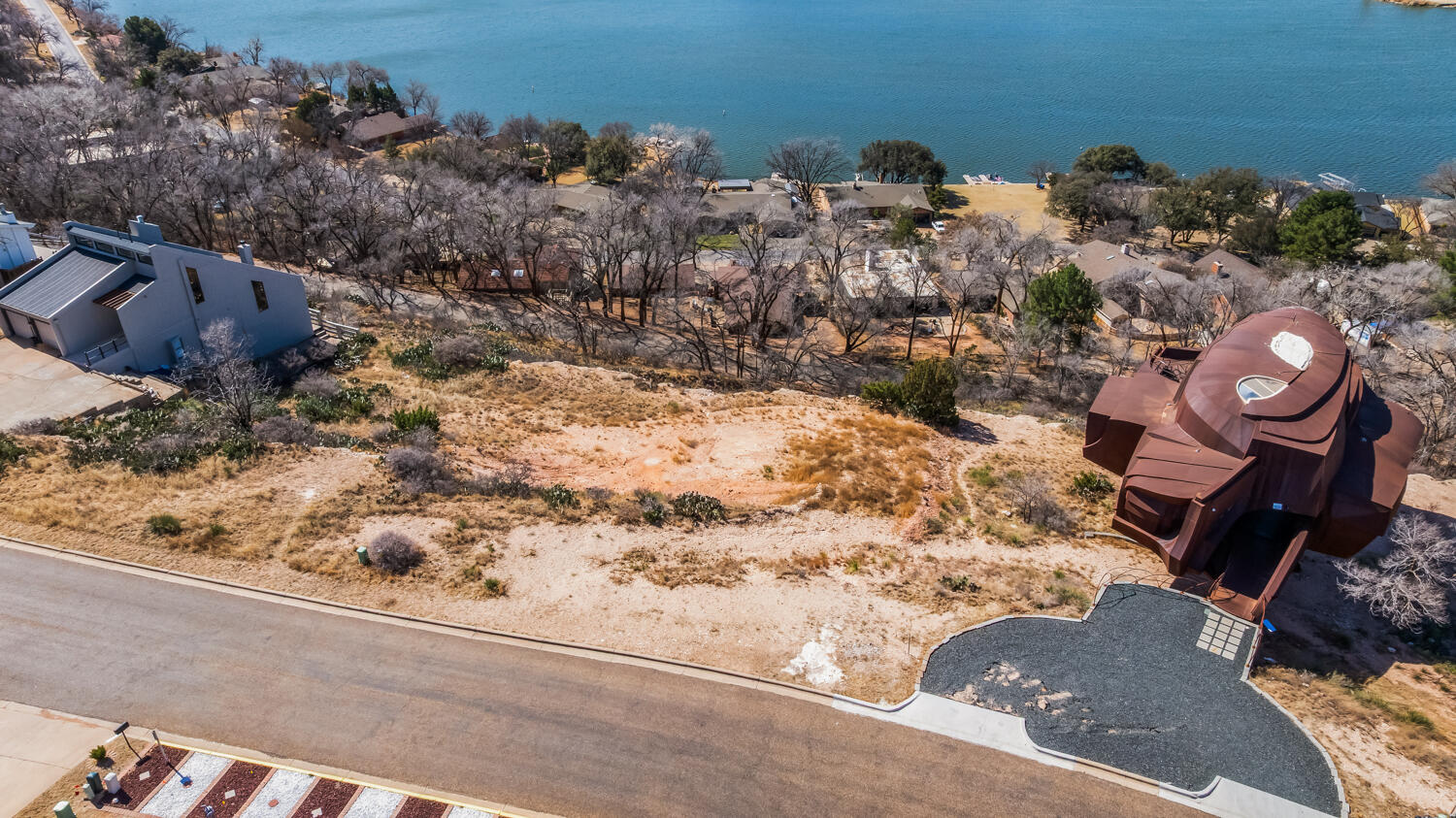 87 East Canyonview Drive Ransom Canyon, TX 79366 - Photo 9 of 42 a view of a backyard of a house