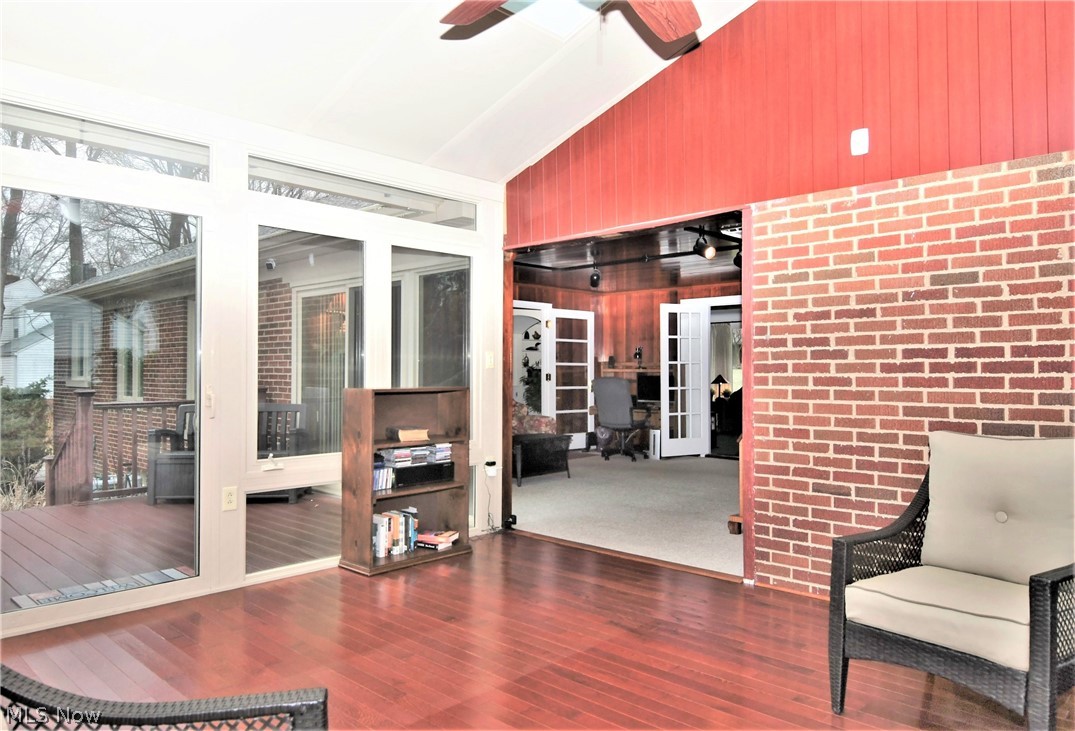 404 Somerset Road Akron, OH 44313 - Photo 13 of 25 Another view from the Sun Room looking into the Family Room and out to the trek deck which wraps around the Family Room and the Sun Room